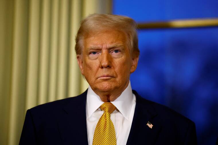 SARAH MEYSSONNIER / POOL PHOTO via REUTERS
                                President-elect Donald Trump attends a meeting in Paris on Dec. 7.