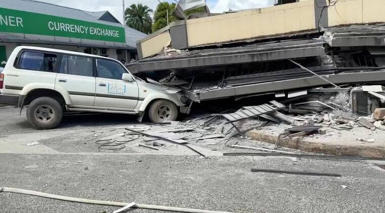 JEREMY ELLISON/VIA REUTERS
                                A vehicle is trapped beneath a collapsed building following a strong earthquake in Port Vila, Vanuatu, December 17, 2024, in this screengrab taken from a social media video.