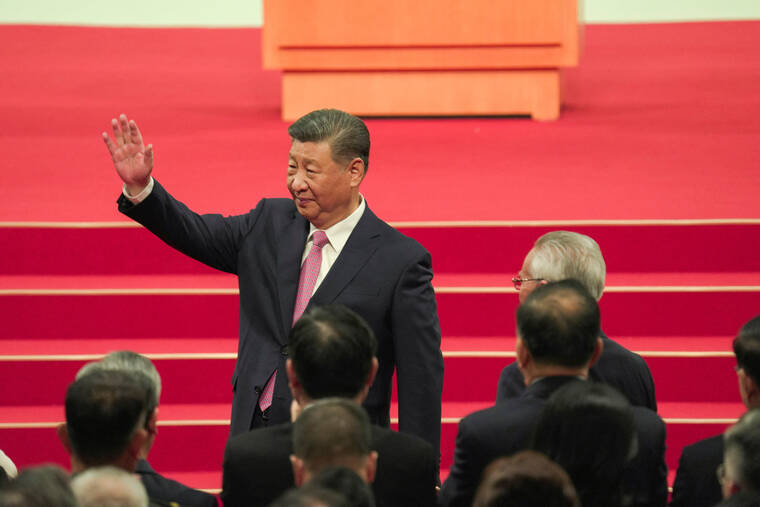 JUSTIN CHAN/POOL VIA REUTERS / DEC. 20
                                China’s President Xi Jinping waves following the inauguration of new Macau leader Sam Hou-fai (not pictured), marking the 25th anniversary of Macau’s handover from Portugal to China, in Macau.