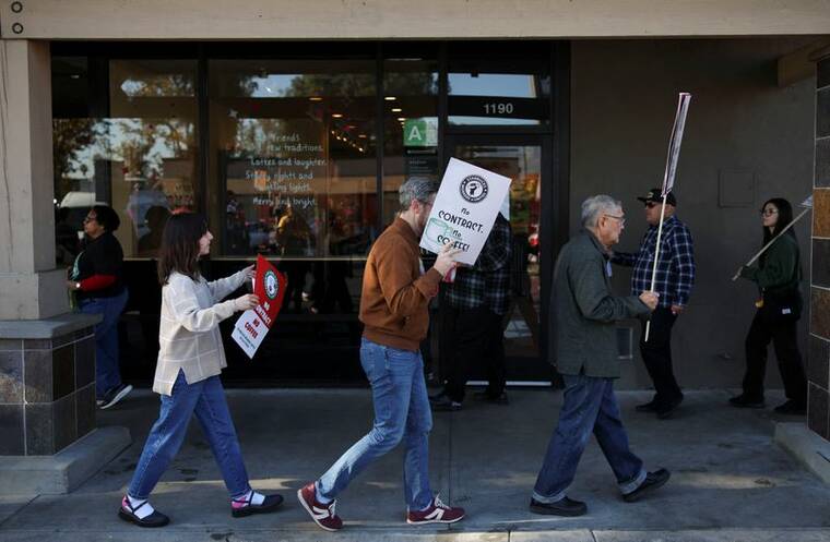 REUTERS/DANIEL COLE
                                Baristas picket in front of a Starbucks in Burbank, Calif., today.