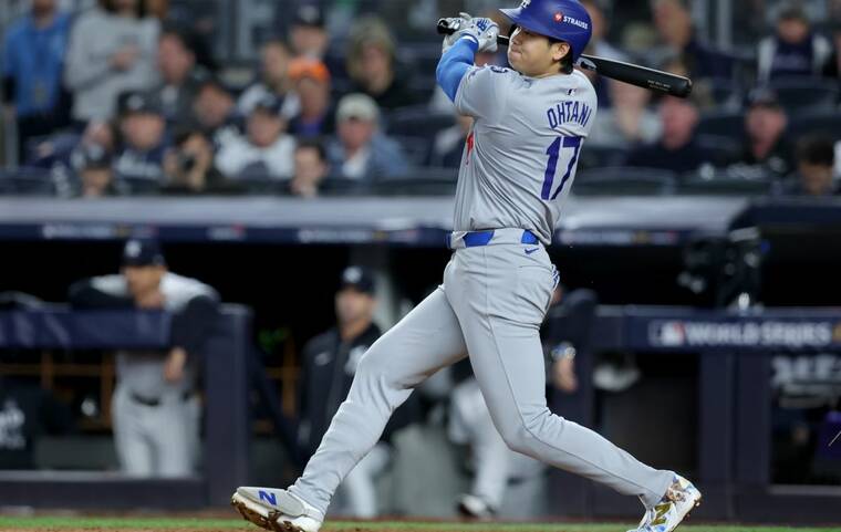 BRAD PENNER-IMAGN IMAGES
                                Los Angeles Dodgers two-way player Shohei Ohtani hits a single during the fifth inning, Tuesday, against the New York Yankees in game four of the 2024 MLB World Series at Yankee Stadium.