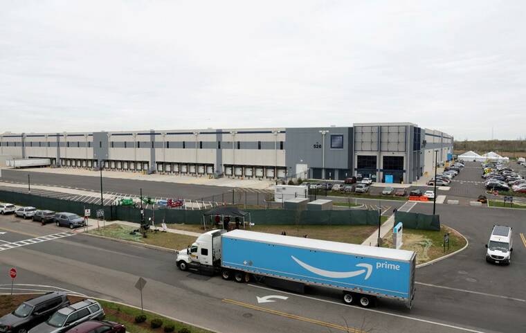 REUTERS/BRENDAN MCDERMID./FILE PHOTO
                                Amazon’s LDJ5 sortation center is seen, as employees begin voting to unionize a second warehouse in the Staten Island borough of New York, in April 2022. Thousands of Amazon.com workers will walk off the job on Thursday at 6 a.m. ET (1 a.m. Hawaii time), in the crucial final days of the holiday season, after union officials said the retailer failed to come to the bargaining table.