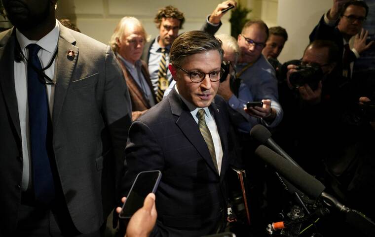 REUTERS/NATHAN HOWARD
                                House Speaker Mike Johnson (R-LA) speaks to the media, following a meeting with fellow Republicans on the day when a potential government shutdown looms during the holidays. The Republican-controlled U.S. House of Representatives passed legislation today that would avert a midnight government shutdown, defying President-elect Donald Trump’s demand to also greenlight trillions of dollars in new debt.