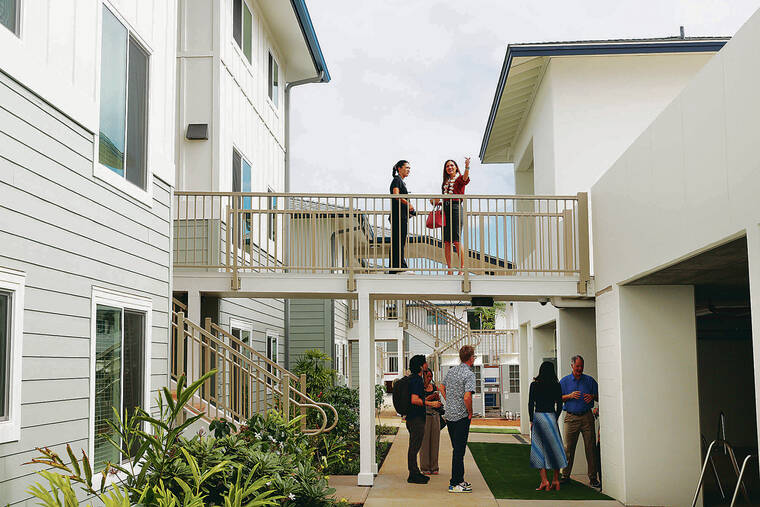 GEORGE F. LEE / GLEE@STARADVERTISER.COM
                                Many toured the grounds at Parkway Village at Kapolei to celebrate its grand opening Tuesday.