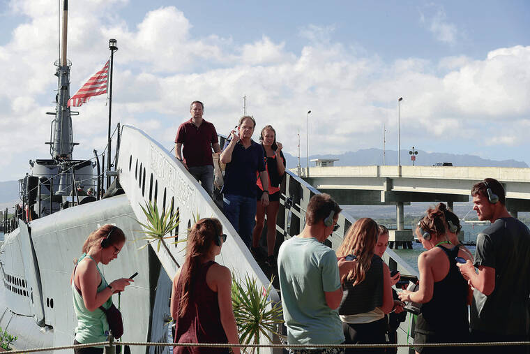 JAMM AQUINO / 2019
                                Despite the 2019 government shutdown entering its second week, museums such as the Bowfin, left, and the Arizona Memorial were able to secure some financial backing to keep operations up and running.