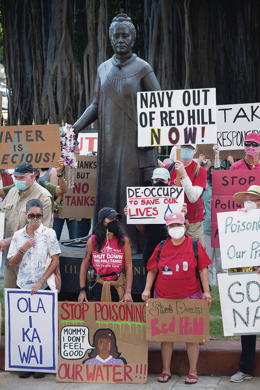 CRAIG T. KOJIMA / 2021
                                Above, community members call for the Navy to shut down Red Hill entirely during a protest in front of the Queen Lili‘uokalani statue.