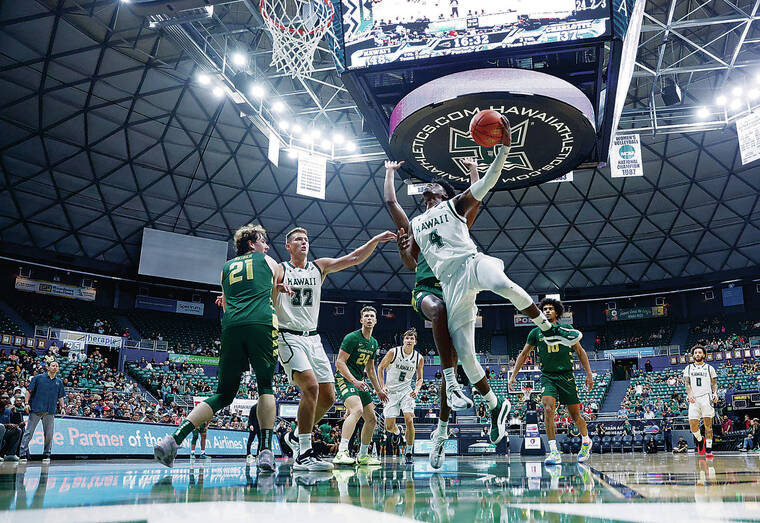 JAMM AQUINO / JAQUINO@STARADVERTISER.COM
                                Hawaii’s Marcus Greene drove to the basket against Charlotte in Sunday’s game at SimpliFi Arena at Stan Sheriff Center.