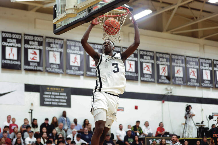 ANDREW LEE / SPECIAL TO THE STAR-ADVERTISER
                                Utah Prep’s forward AJ Dybantsa (3) slams down a dunk during the Iolani Classic Boys Basketball Semifinal Game against Oak Hill on Friday at ‘Iolani School in Honolulu.