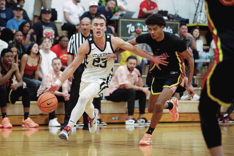 ANDREW LEE / SPECIAL TO THE STAR-ADVERTISER
                                Utah Prep’s guard JJ Mandaquit (23) drives down court past Oak Hill’s guard DeMarco Johnson (1) during the Iolani Classic Boys Basketball Semifinal Game on Friday, at Iolani School in Honolulu, Hawaii.