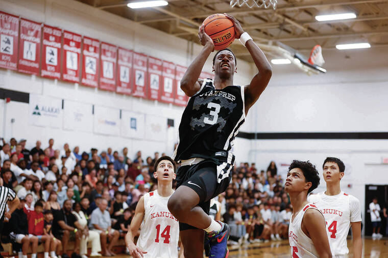 GEORGE F. LEE / GLEE@STARADVERTISER.COM
                                Utah Prep AJ Dybantsa drives past Kahuku Red Raiders Ronin Naihe, Noah Feinga and Benson Goo during an Iolani Classic Boys basketball game Wednesday at Iolani Gym.