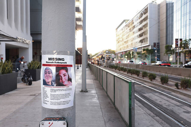 LOS ANGELES TIMES / NOV. 21
                                A flyer with photos of Hannah Kobayashi, who went missing Nov. 8, is posted near the Metro station where she was last seen in downtown Los Angeles.